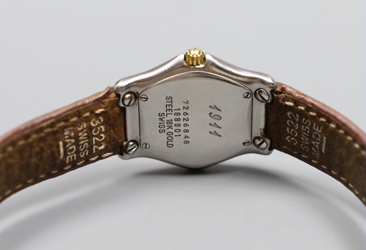 A lady's 18K and steel Ebel 1911 quartz wrist watch, on a leather strap with steel deployment clasp, no box or papers.